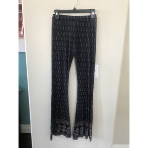 TILLY'S FULL TILT PRINT FLARE PANTS FIGURE HUGGING